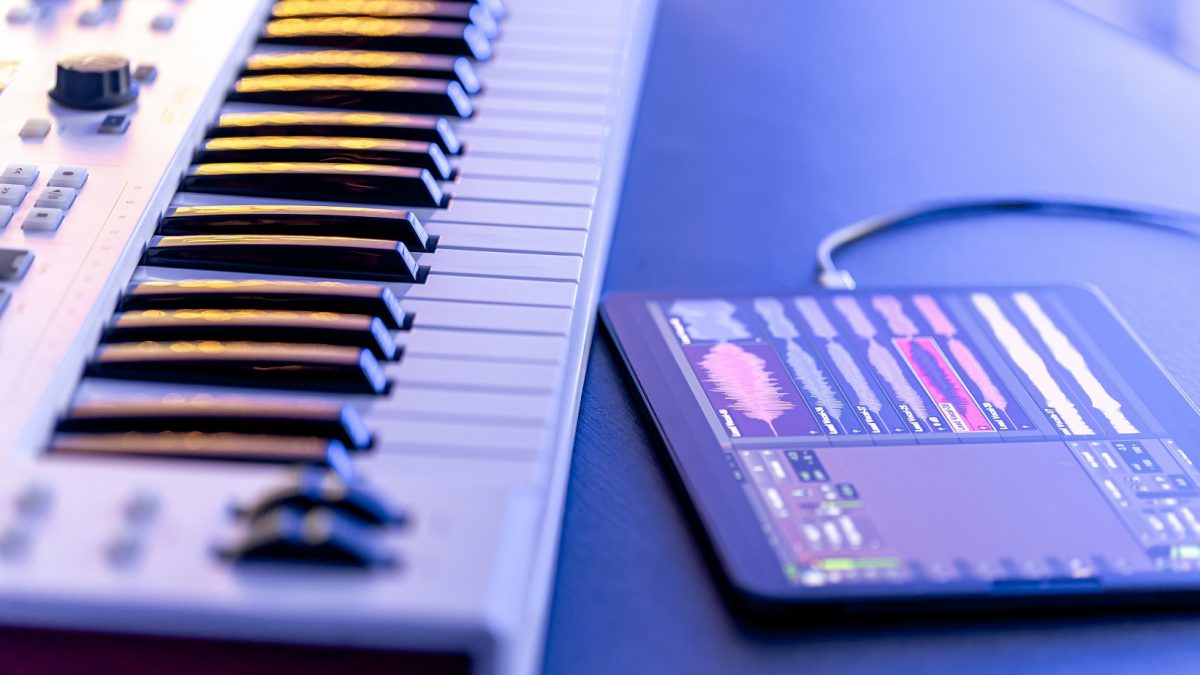 A MIDI keyboard with a tablet