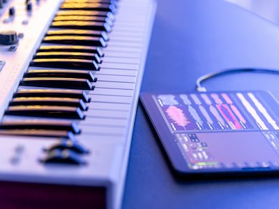 A MIDI keyboard with a tablet