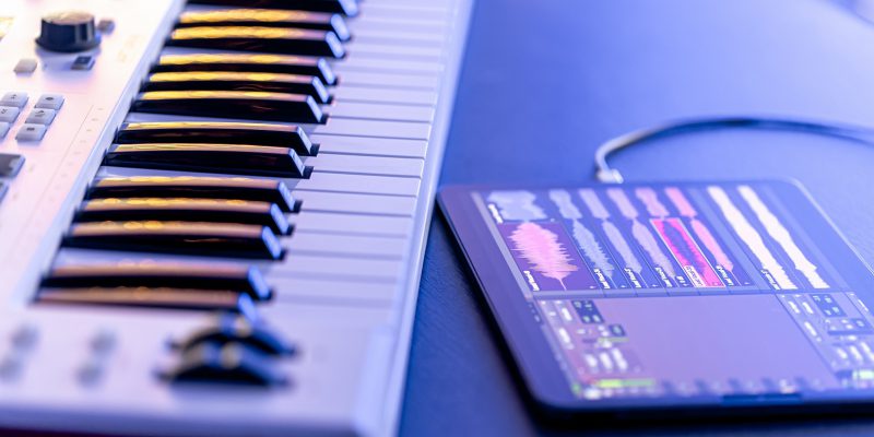 A MIDI keyboard with a tablet