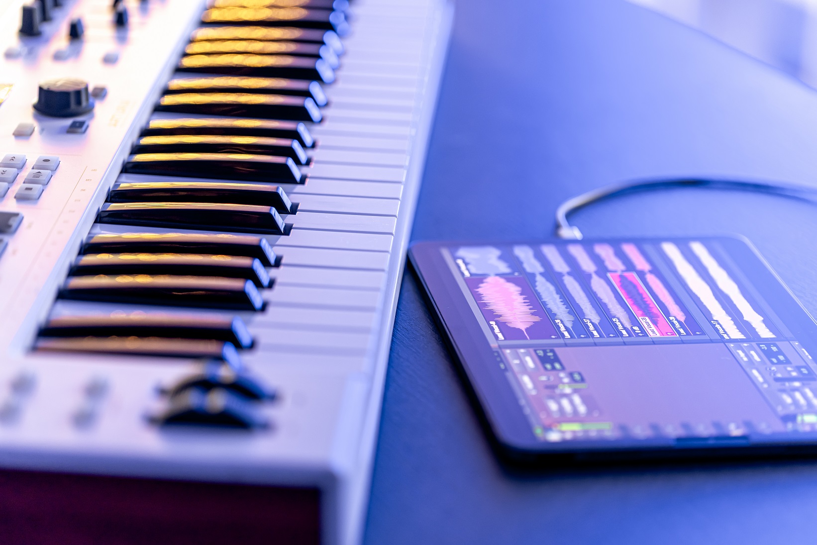 A MIDI keyboard with a tablet