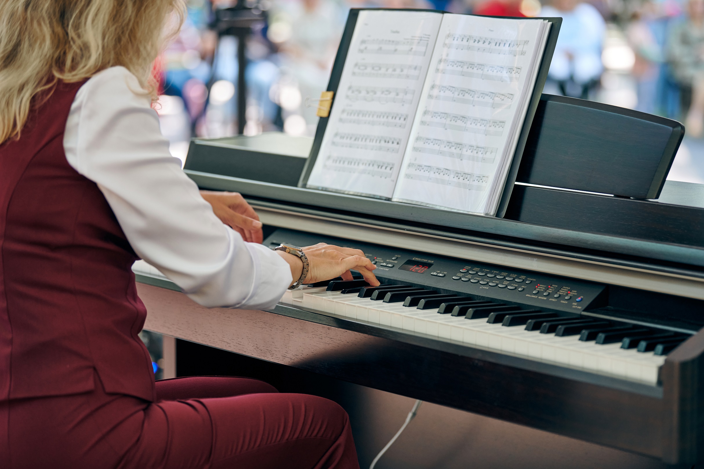 A person playing a digital piano